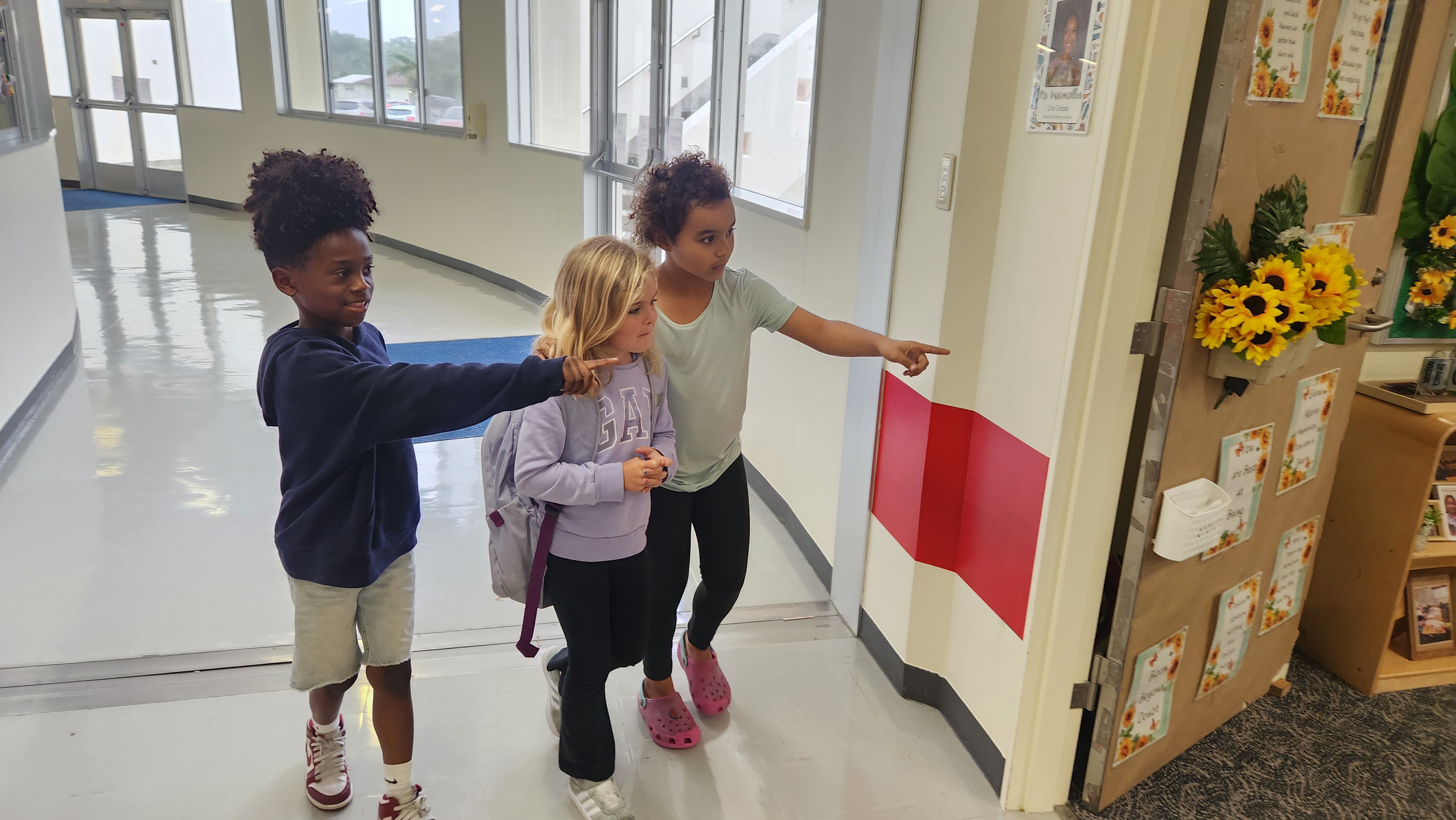 Students escorting a new student to class 
