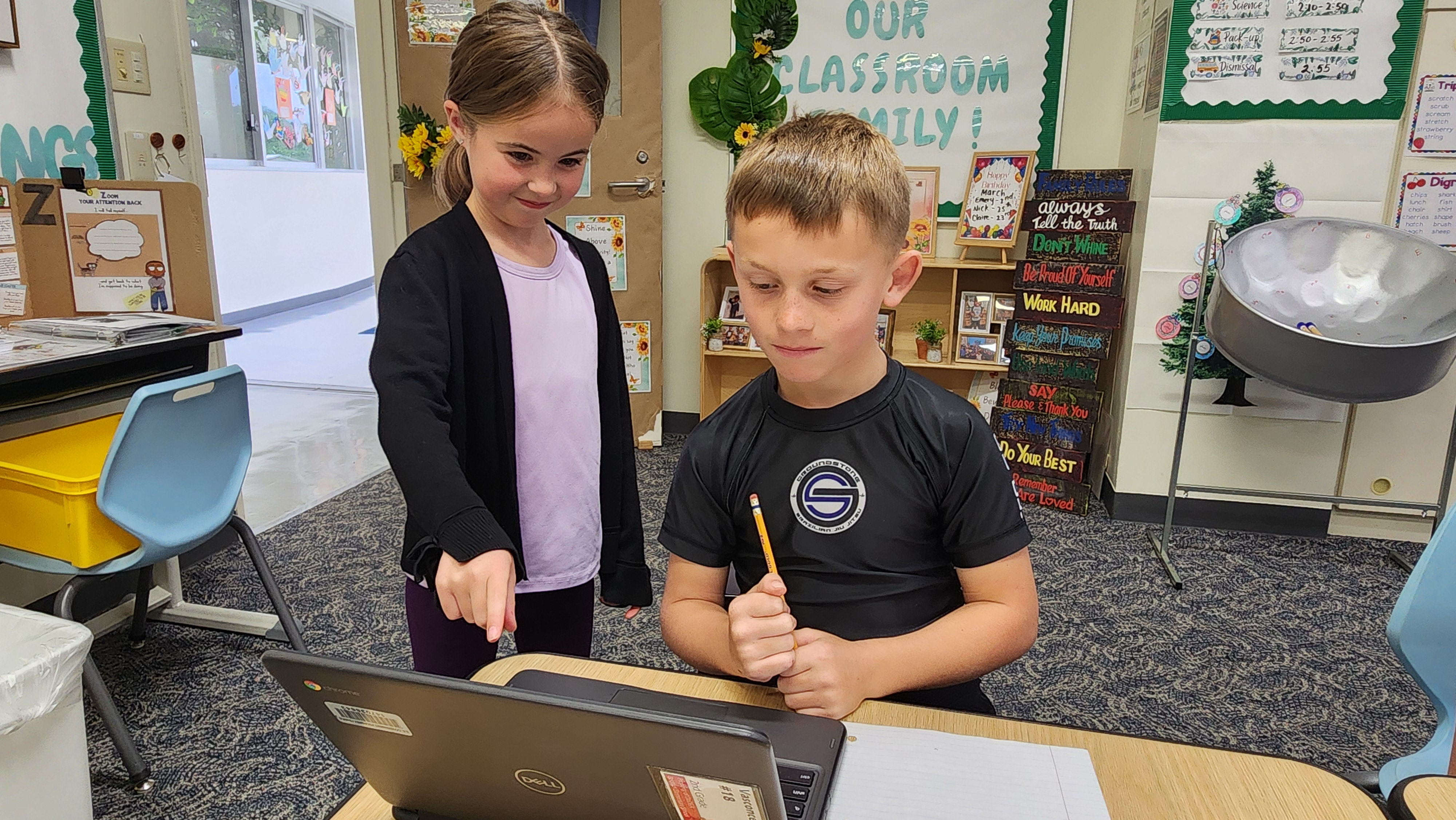 Students helping a new student find his seat